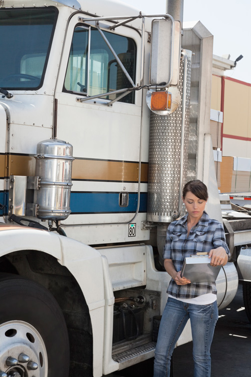 Woman Inspecting Truck